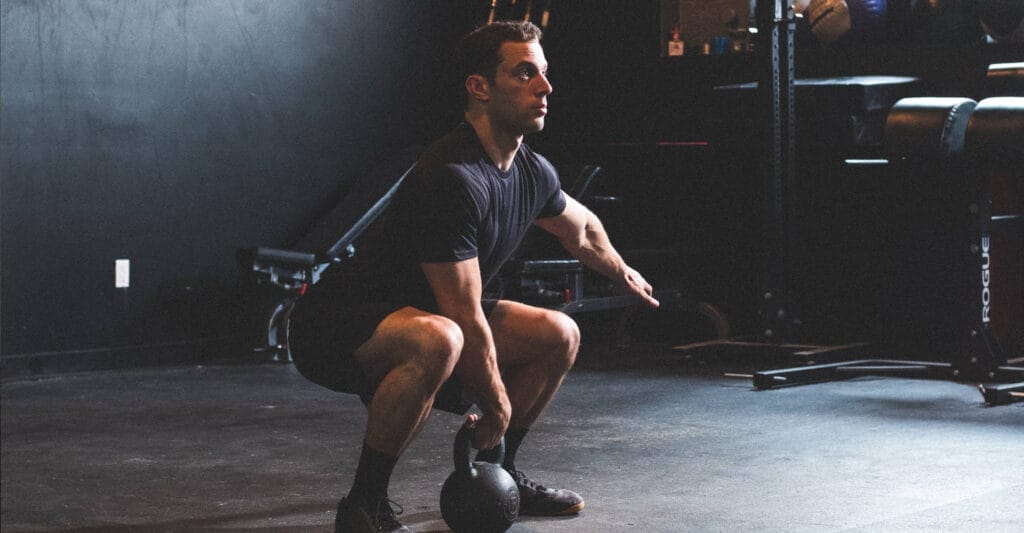 Man working out with kettlebell