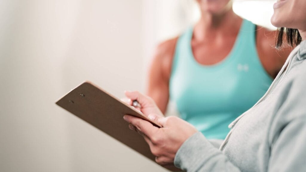 Coach explaining online training program goals